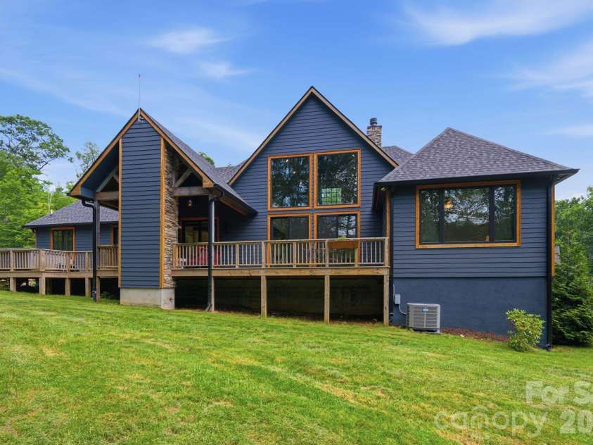 289 Linville River Drive, Linville, NC 28646.  MLS# CAR4405744, YatesRealty ID 39063. Partial view of back deck and generator