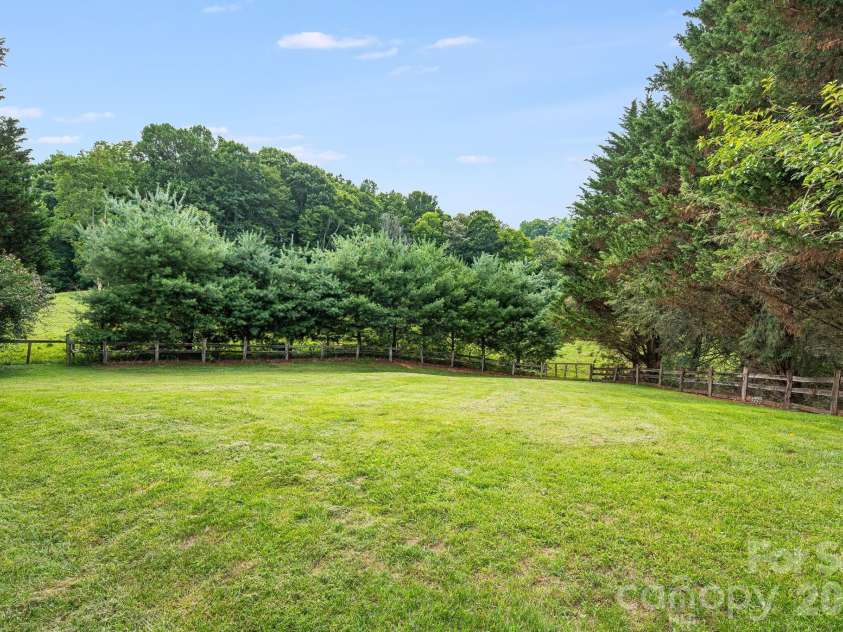 200 Black Hawk Trail, Waynesville, NC 28785.  MLS# CAR4404576, YatesRealty ID 39066. Back Yard