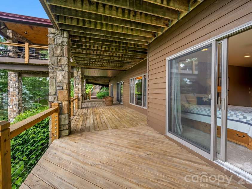815 Crest Trail, Linville, NC 28646.  MLS# CAR4406068, YatesRealty ID 39068. Lower Level Deck