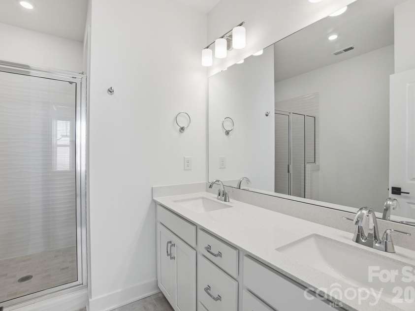 1124 Kokomo Lane, Charlotte, NC 28206.  MLS# CAR4385352, YatesRealty ID 39071. Owner's Bath with Dual Vanities