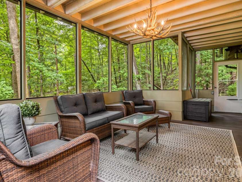 1943 Buffalo Creek Road, Lake Lure, NC 28746.  MLS# CAR4394743, YatesRealty ID 39073. Side enclosed deck main floor