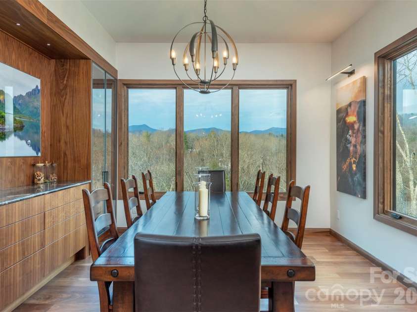 158 Riverbend Forest Drive, Asheville, NC 28805.  MLS# CAR4399646, YatesRealty ID 39092. Dining room has custom cabinets that are back lit for beautiful enchancements while dining and enoying mountian views