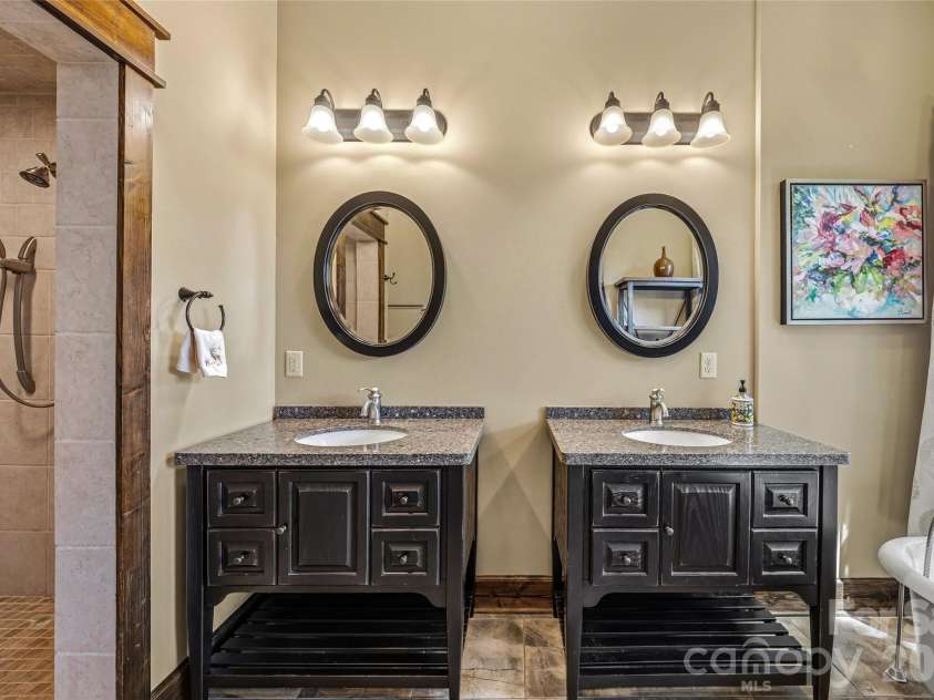 136 Merrills Ridge Road, Asheville, NC 28803.  MLS# CAR4400955, YatesRealty ID 39094. Primary bath with double sinks