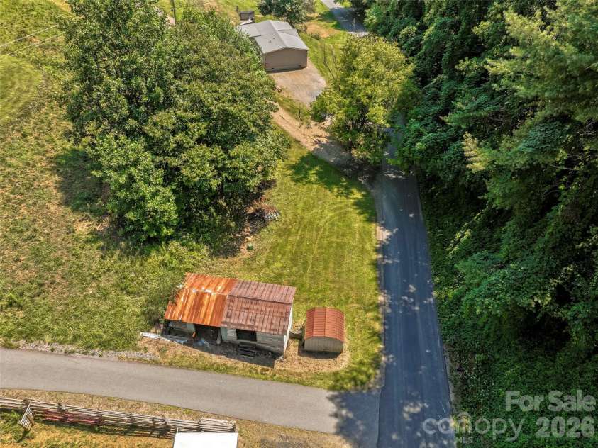 797 Pleasant Valley Road, Burnsville, NC 28714.  MLS# CAR4406248, YatesRealty ID 39102. Multiple storage sheds