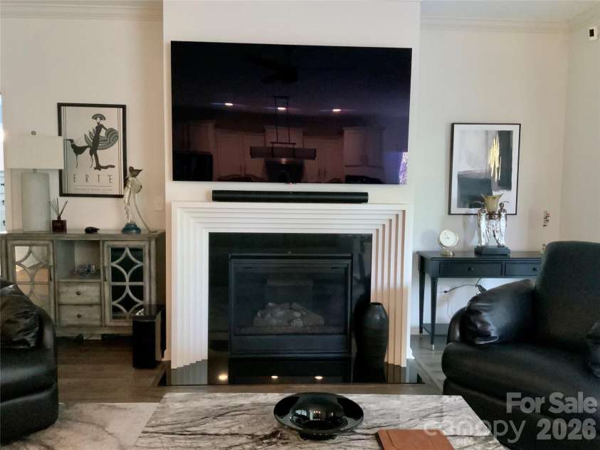 5064 Stonehill Lane, Matthews, NC 28104.  MLS# CAR4405518, YatesRealty ID 39104. CUSTOM FIREPLACE SURROUND WITH GAS LOGS