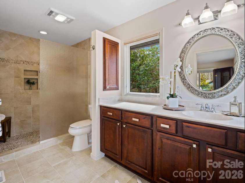 33 Ugedaliyvi Court, Brevard, NC 28712.  MLS# CAR4349656, YatesRealty ID 3911. Primary bath with custom tile