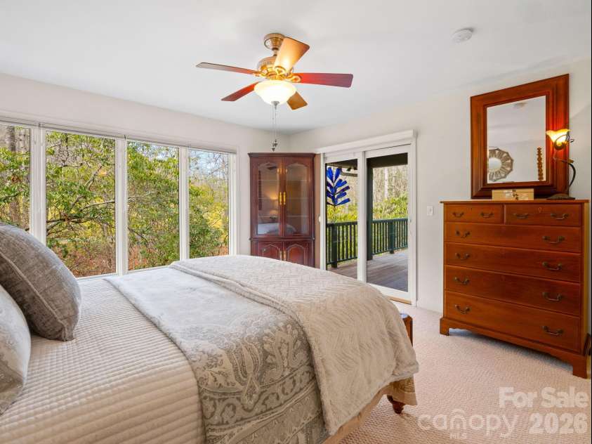 33 Ugedaliyvi Court, Brevard, NC 28712.  MLS# CAR4349656, YatesRealty ID 3911. Windows with stream view and doors to the deck