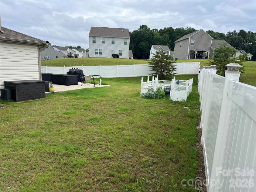 714 Lexington Drive, Albemarle, NC 28001.  MLS# CAR4402984, YatesRealty ID 39111. Inside backyard from front corner