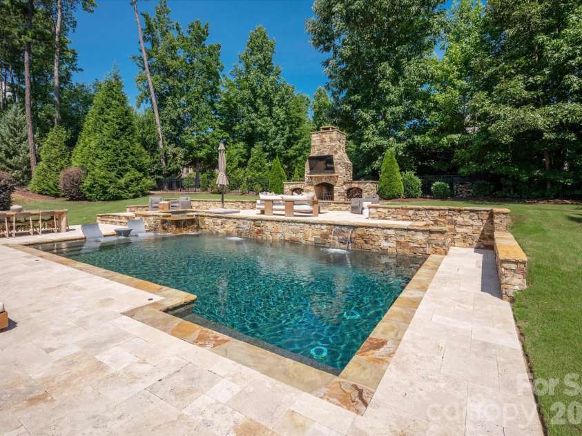 971 Castlewatch Drive, Fort Mill, SC 29708.  MLS# CAR4402359, YatesRealty ID 39121. Expansive travertine patio