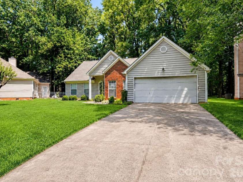 6213 Nevin Road, Charlotte, NC 28262.  MLS# CAR4363288, YatesRealty ID 39124. Digitally enhanced; grass virtually added