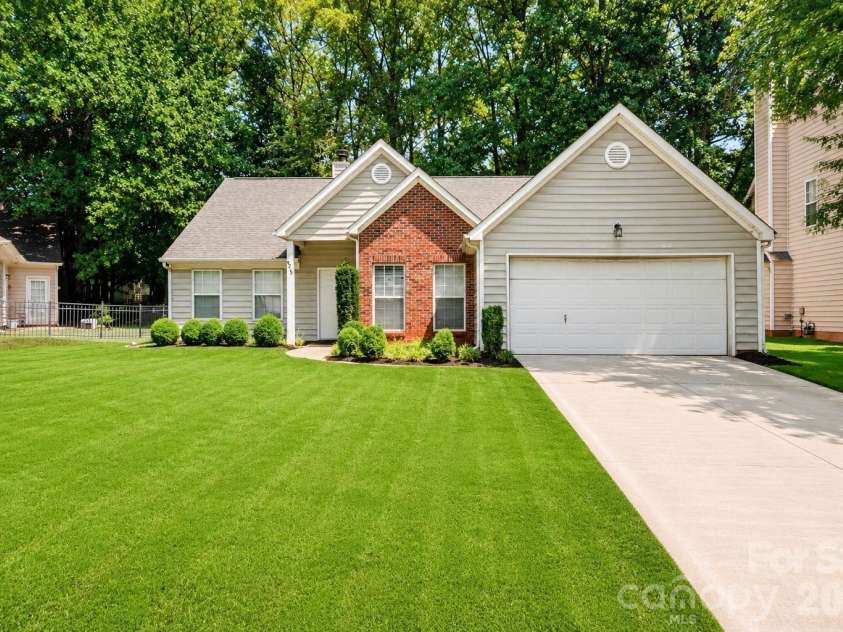 6213 Nevin Road, Charlotte, NC 28262.  MLS# CAR4363288, YatesRealty ID 39124. Digitally enhanced; grass virtually added