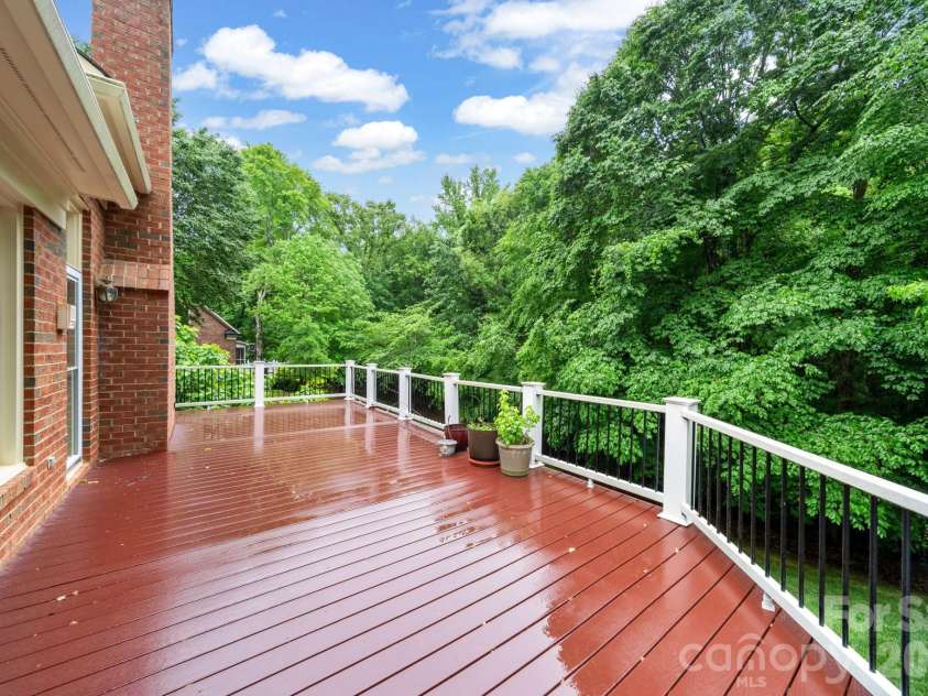 5215 Silchester Lane, Charlotte, NC 28215.  MLS# CAR4361255, YatesRealty ID 39146. Enjoy the serene backyard from the easy to maintain Trex composite deck