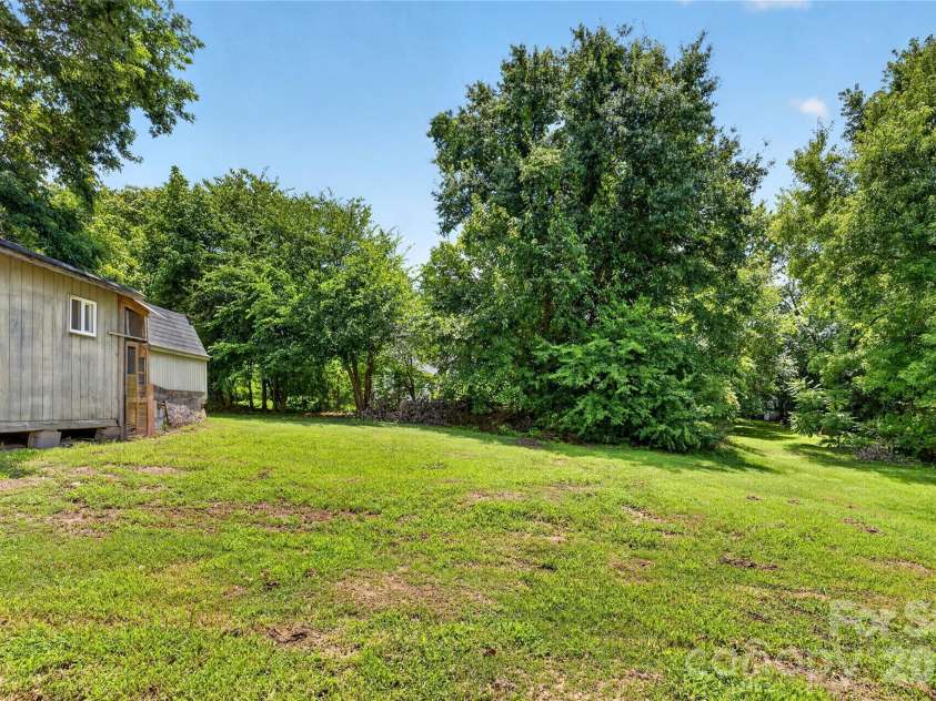 384 Grace Avenue, Concord, NC 28027.  MLS# CAR4402919, YatesRealty ID 39149. Backyard w/ Shed