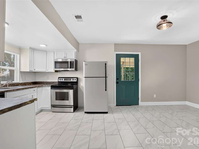 384 Grace Avenue, Concord, NC 28027.  MLS# CAR4402919, YatesRealty ID 39149. Kitchen & Dinning