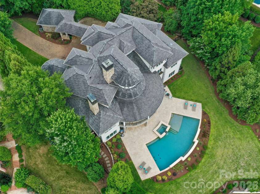 11717 Smart Lane, Charlotte, NC 28277.  MLS# CAR4403907, YatesRealty ID 39154. 48 ft Resort Style Pool with over 2,000 sq ft of travertine decking