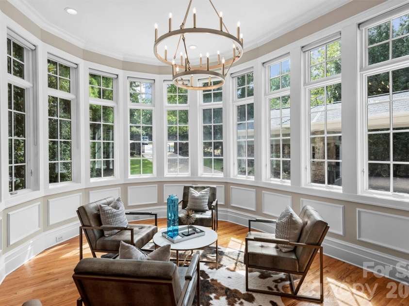 11717 Smart Lane, Charlotte, NC 28277.  MLS# CAR4403907, YatesRealty ID 39154. Inspiring study with double reeded glass doors.  Eleven windows with transoms allow light to stream in taking advantage of another Circular Elevation and 12'ceiling