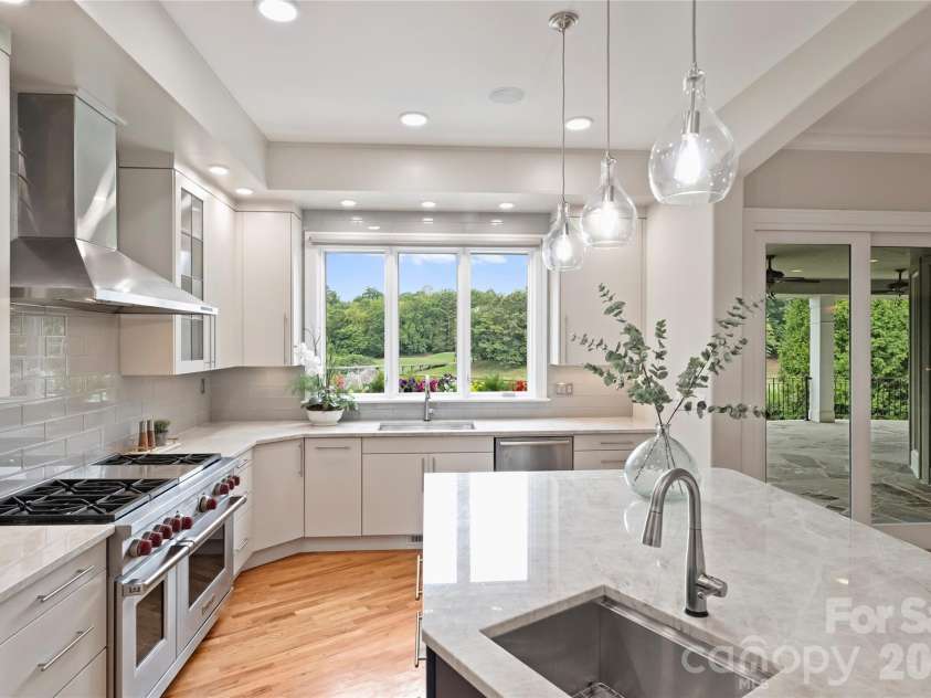 11717 Smart Lane, Charlotte, NC 28277.  MLS# CAR4403907, YatesRealty ID 39154. Second sink in the island also features lighted cabinets.