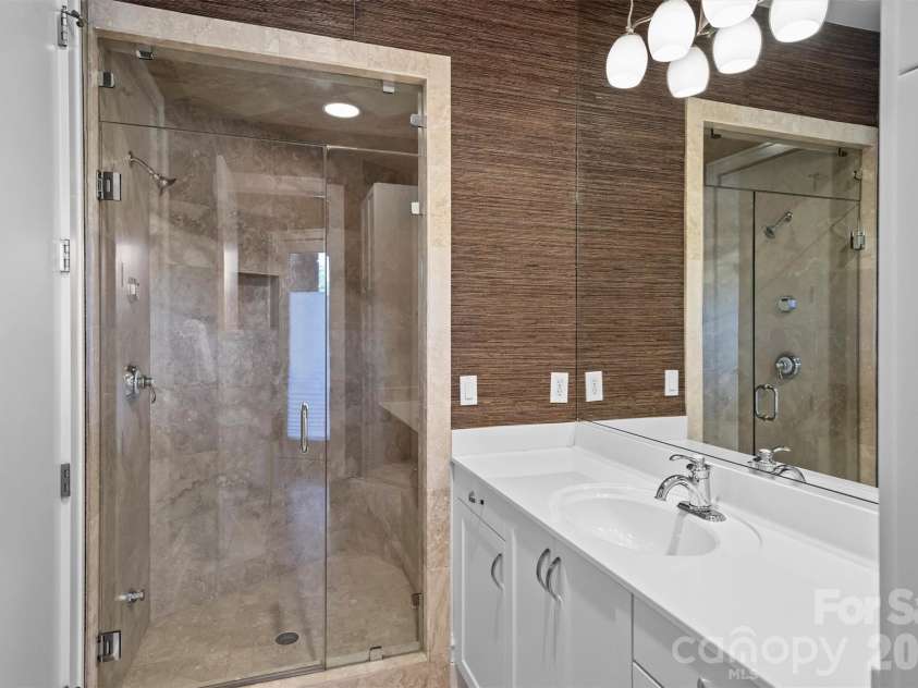 11717 Smart Lane, Charlotte, NC 28277.  MLS# CAR4403907, YatesRealty ID 39154. Separate pool bathroom w/a Steammist steam shower & direct patio access