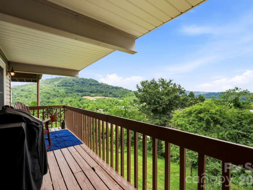 16 Audubon Drive, Asheville, NC 28804.  MLS# CAR4397266, YatesRealty ID 39158. Long range views off the deck