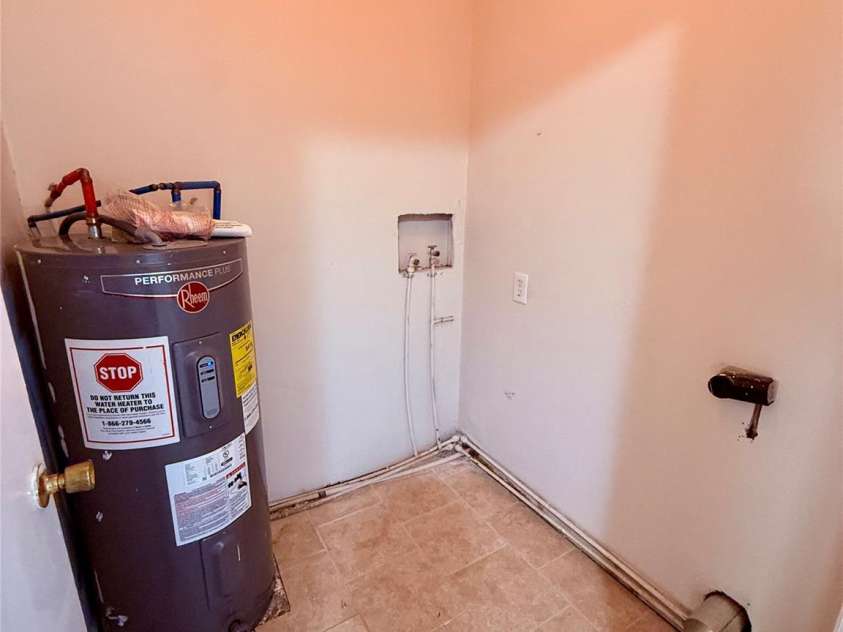 4209 Homeplace Drive, Shelby, NC 28152.  MLS# CAR4302755, YatesRealty ID 3918. Laundry room. Electric water heater.