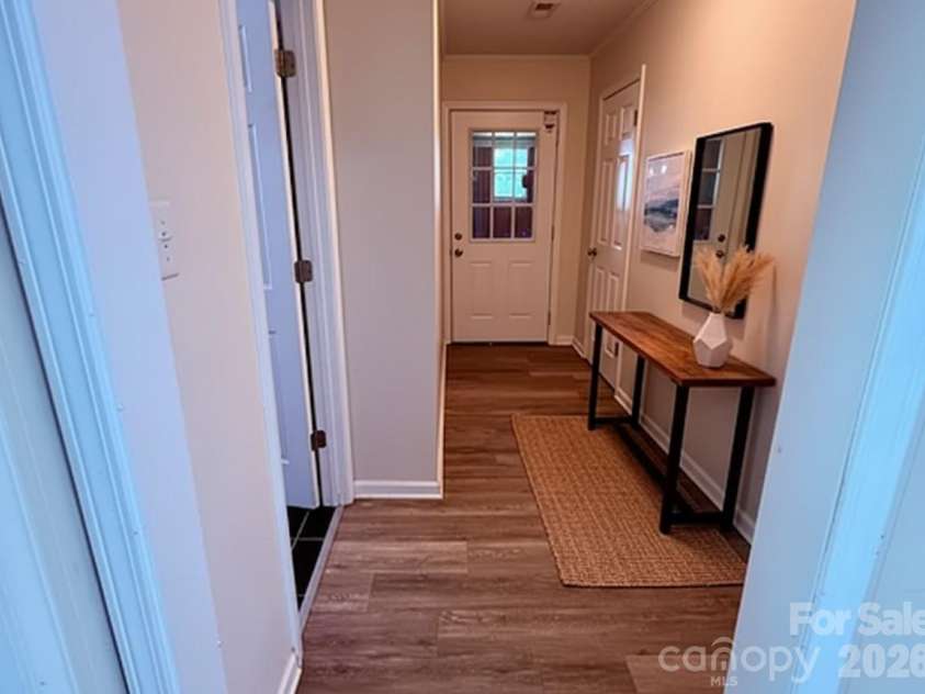 4209 Homeplace Drive, Shelby, NC 28152.  MLS# CAR4302755, YatesRealty ID 3918. Virtually staged Hallway to garage