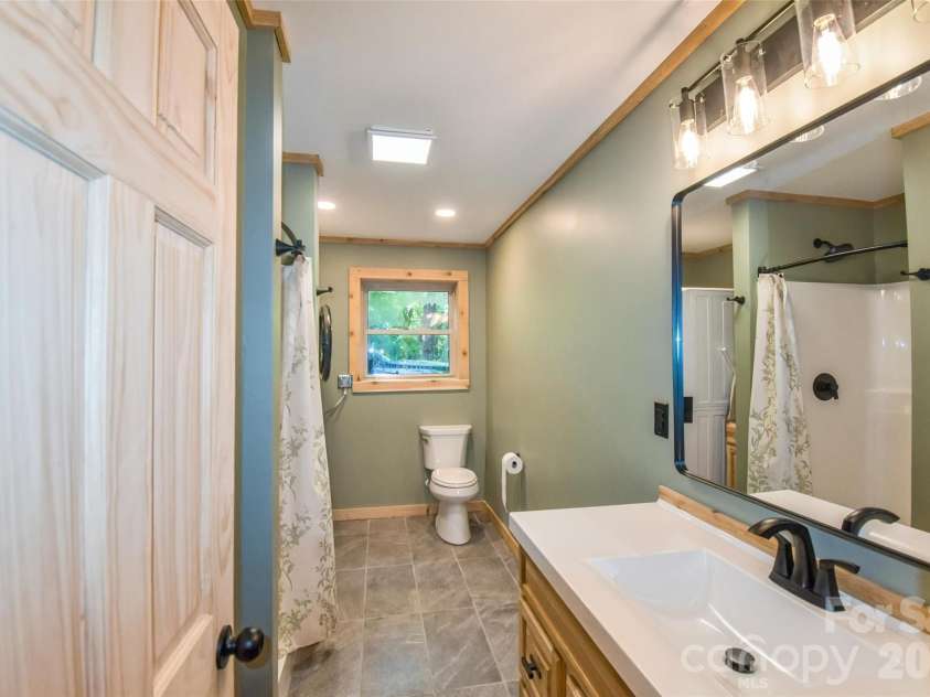336 Hillside Road, Penrose, NC 28766.  MLS# CAR4405552, YatesRealty ID 39185. Basement bathroom