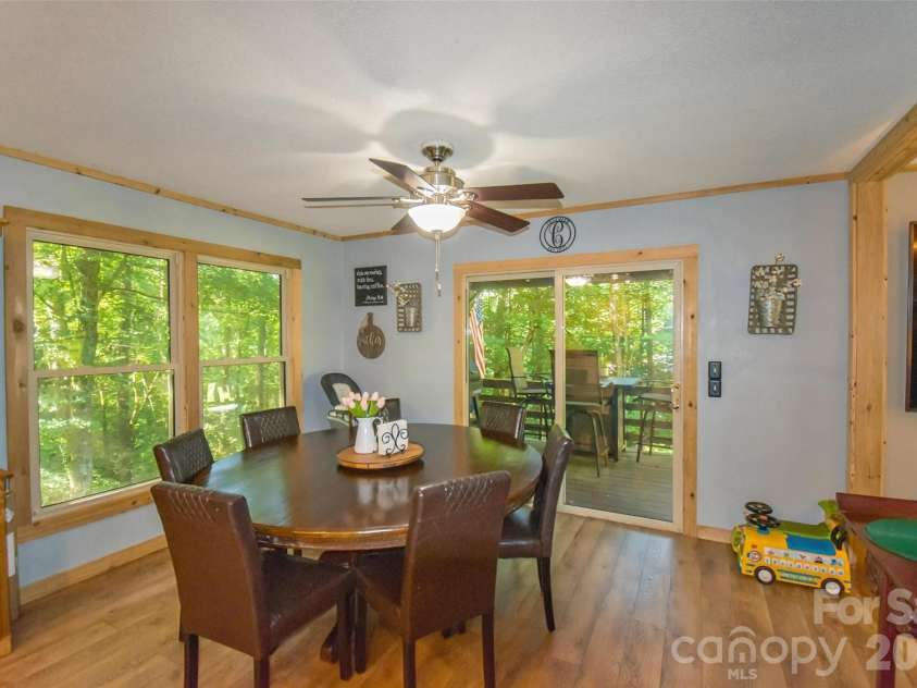 336 Hillside Road, Penrose, NC 28766.  MLS# CAR4405552, YatesRealty ID 39185. Dining room to deck