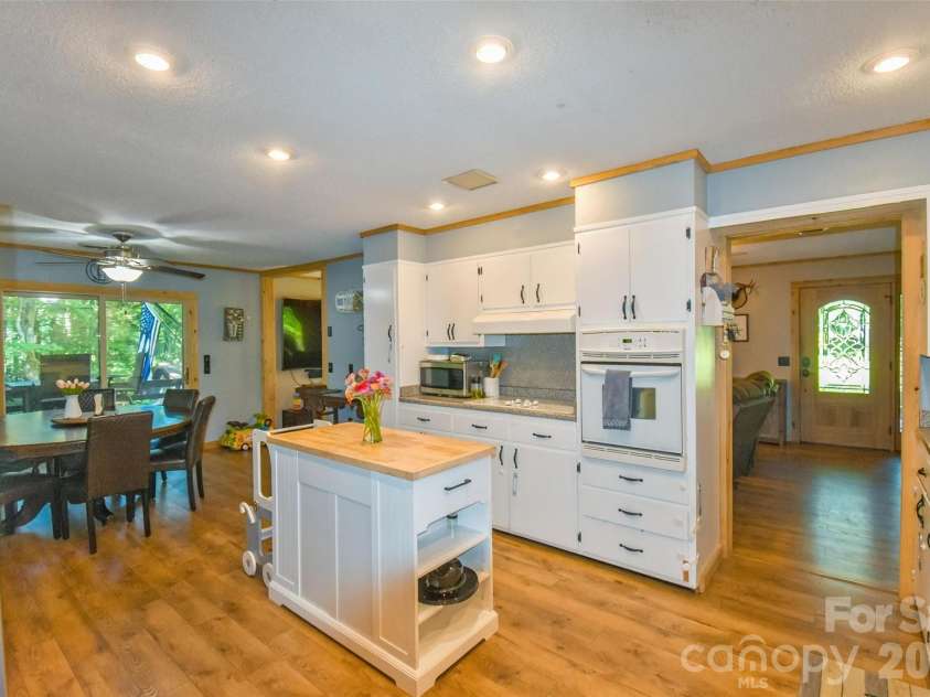 336 Hillside Road, Penrose, NC 28766.  MLS# CAR4405552, YatesRealty ID 39185. Kitchen looking to living room