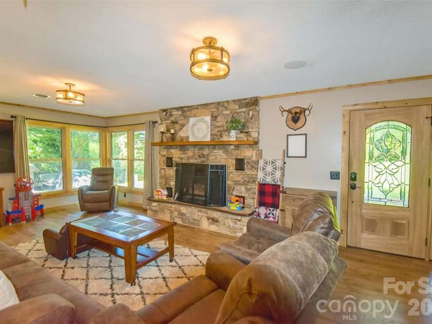 336 Hillside Road, Penrose, NC 28766.  MLS# CAR4405552, YatesRealty ID 39185. Living room with fireplace