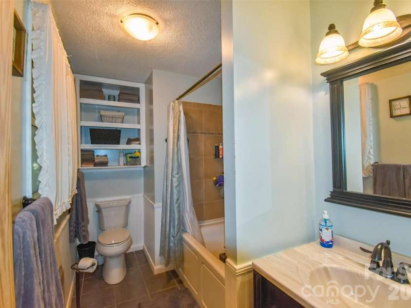 336 Hillside Road, Penrose, NC 28766.  MLS# CAR4405552, YatesRealty ID 39185. Primary bath