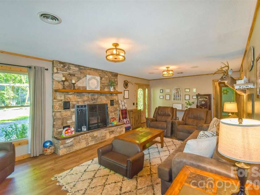 336 Hillside Road, Penrose, NC 28766.  MLS# CAR4405552, YatesRealty ID 39185. View from dining into living room
