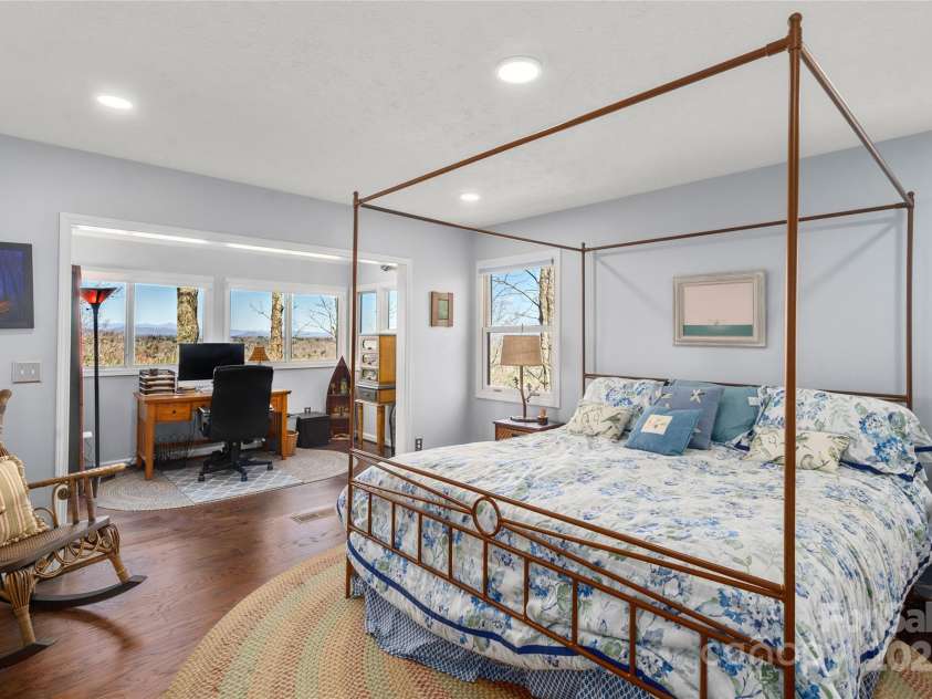270 Ridge Drive, Saluda, NC 28773.  MLS# CAR4132159, YatesRealty ID 3919. Main floor primary bedroom boasts some of the best mountain views around!