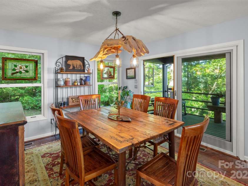 270 Ridge Drive, Saluda, NC 28773.  MLS# CAR4132159, YatesRealty ID 3919. Screened porch off dining room with long range views.