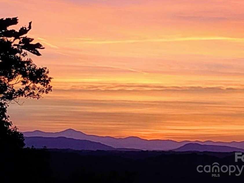 270 Ridge Drive, Saluda, NC 28773.  MLS# CAR4132159, YatesRealty ID 3919. Sunset view taken from back deck.