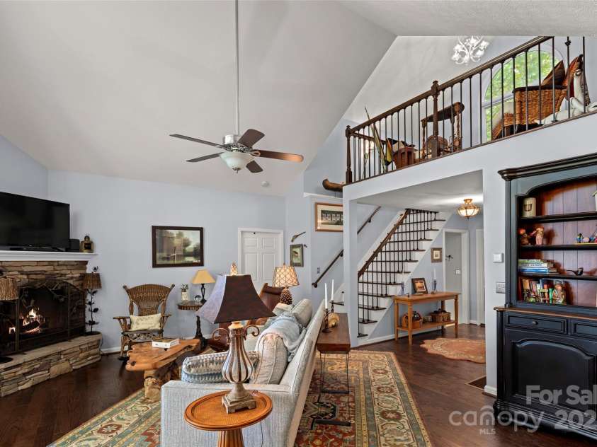 270 Ridge Drive, Saluda, NC 28773.  MLS# CAR4132159, YatesRealty ID 3919. View of loft from great room. Doorway by stairs to the primary bedroom