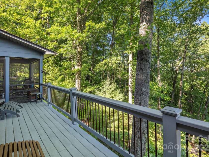 270 Ridge Drive, Saluda, NC 28773.  MLS# CAR4312875, YatesRealty ID 3919. Back deck and screened porch