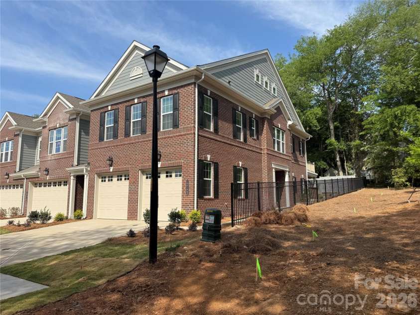 12123 Lavinia Lane, Charlotte, NC 28277.  MLS# CAR4295274, YatesRealty ID 39236. Corner townhome with tree preserve beside = beautiful view!