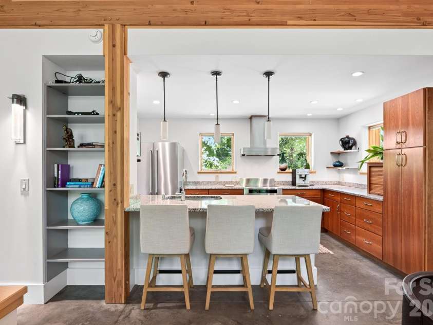 253 Edgewood Road, Asheville, NC 28804.  MLS# CAR4401448, YatesRealty ID 39237. Breakfast bar with easy flow between kitchen and dining area.