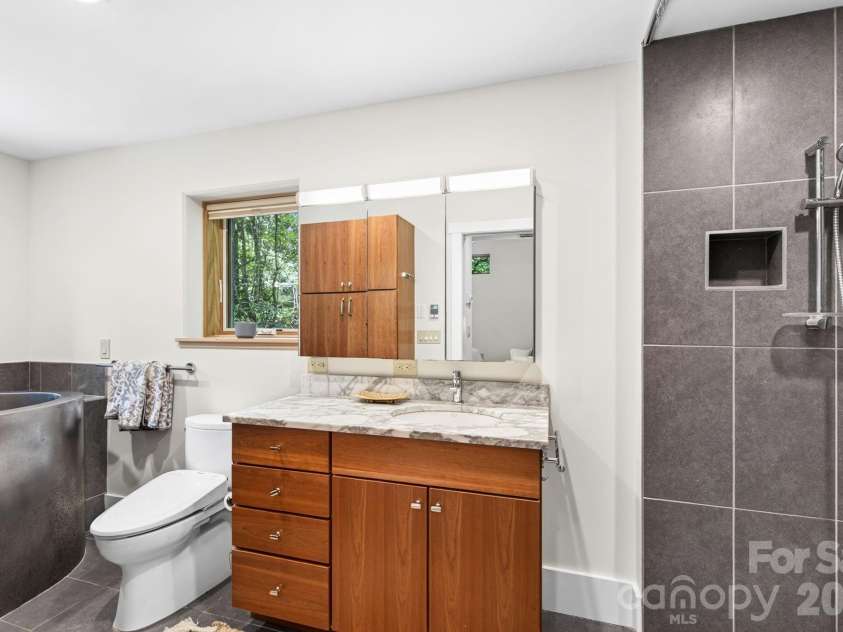 253 Edgewood Road, Asheville, NC 28804.  MLS# CAR4401448, YatesRealty ID 39237. Primary bath.