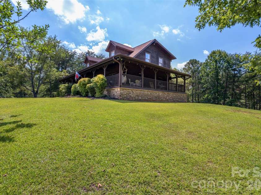 4551 Lake Adger Parkway, Mill Spring, NC 28756.  MLS# CAR4401928, YatesRealty ID 39249. Front and Right side view