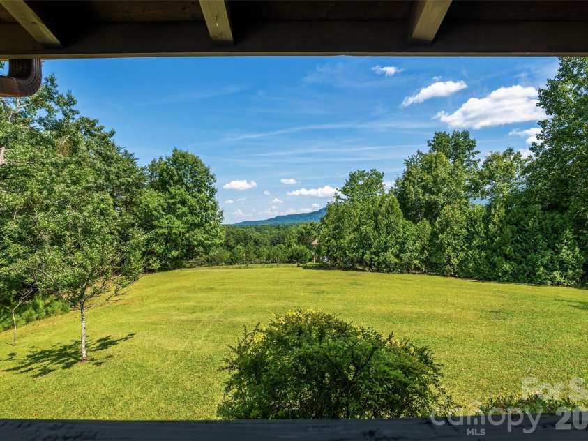 4551 Lake Adger Parkway, Mill Spring, NC 28756.  MLS# CAR4401928, YatesRealty ID 39249. Level front yard for summer entertaining