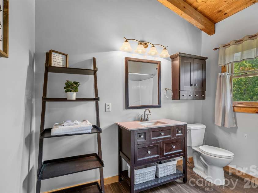 4551 Lake Adger Parkway, Mill Spring, NC 28756.  MLS# CAR4401928, YatesRealty ID 39249. Primary en-suite bath has ceramic floors