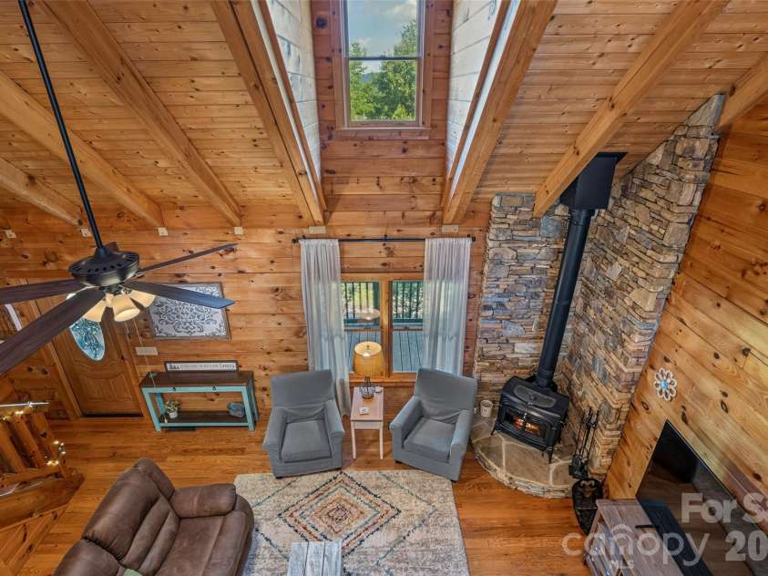 4551 Lake Adger Parkway, Mill Spring, NC 28756.  MLS# CAR4401928, YatesRealty ID 39249. View from loft and distant mountain through dormer