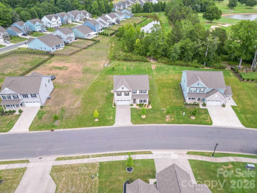 1046 Stone Marker Drive, Monroe, NC 28112.  MLS# CAR4406493, YatesRealty ID 39276. White house in center