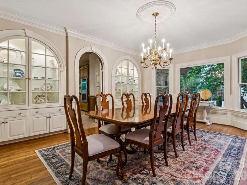 5121 Chillmark Road, Charlotte, NC 28226.  MLS# CAR4406043, YatesRealty ID 39281. Arched and lighted built-ins in the dining room.
