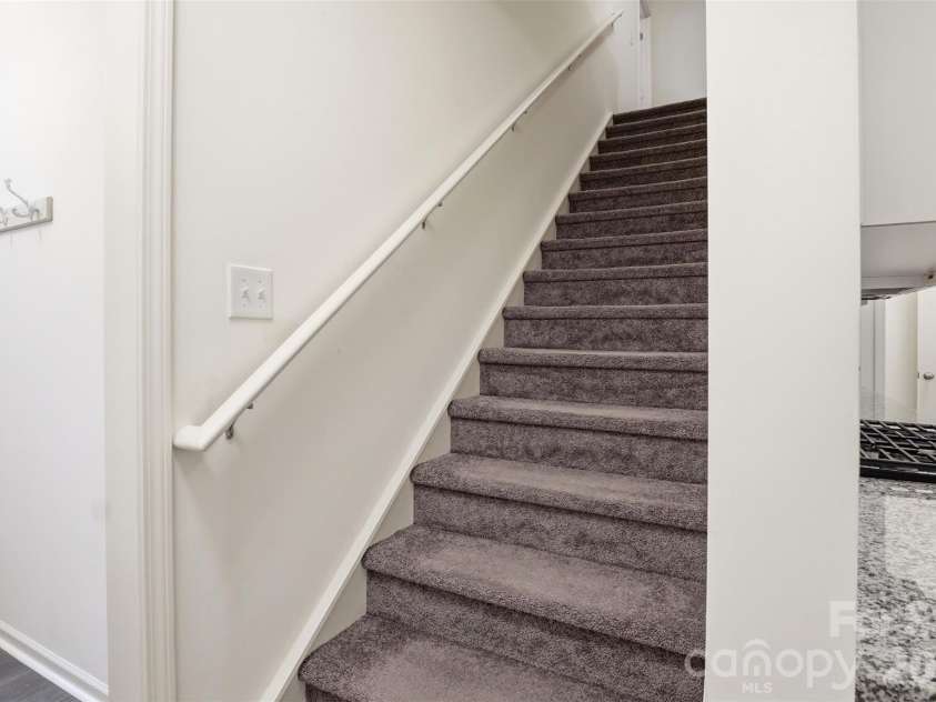 6500 Kinder Lane, Lancaster, SC 29720.  MLS# CAR4393642, YatesRealty ID 39282. Stairs to bedrooms off front entry behind kitchen