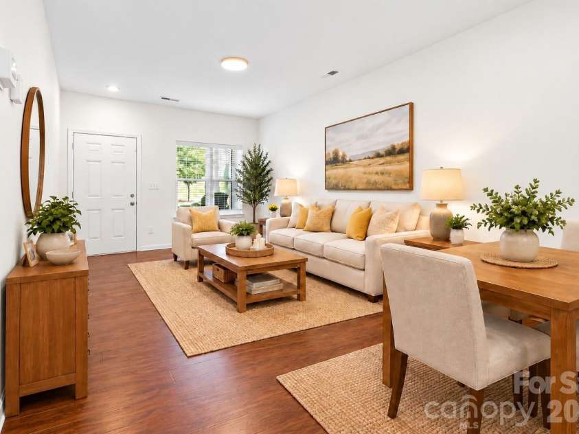 5516 John Mcdowell Place, Charlotte, NC 28217.  MLS# CAR4404823, YatesRealty ID 39299. Virtually staged for a living room and dining area