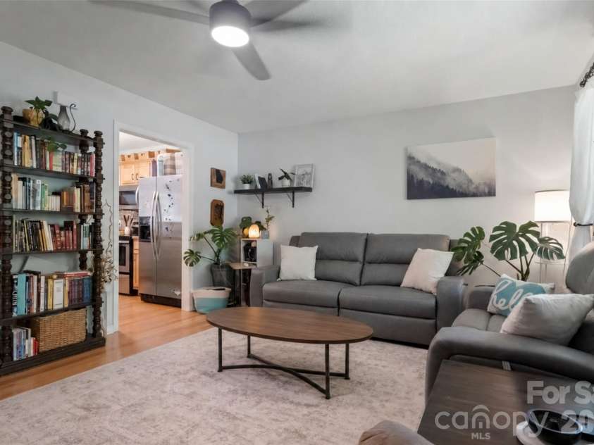18 Old West Chapel Road, Asheville, NC 28803.  MLS# CAR4404864, YatesRealty ID 39301. AI staging with center table concept