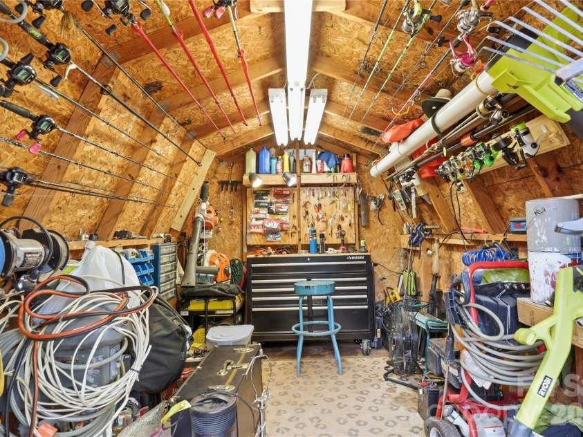 21013 Entrada Drive, Cornelius, NC 28031.  MLS# CAR4402041, YatesRealty ID 39320. A fishing and tool lover’s dream workspace.