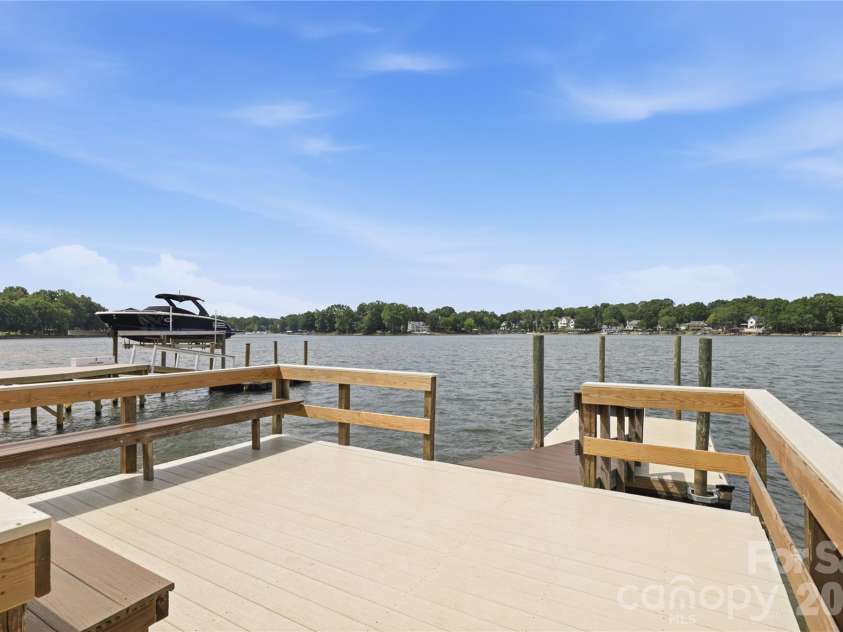 21013 Entrada Drive, Cornelius, NC 28031.  MLS# CAR4402041, YatesRealty ID 39320. A spacious dock platform for fishing, relaxing or taking in the view.